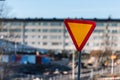 Give way sign in front of a housing complex Royalty Free Stock Photo