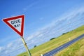 Give way sign on natural background