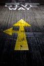 Give way yellow arrows painted on concrete road Royalty Free Stock Photo