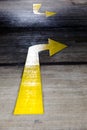 Give way yellow arrows painted on concrete road Royalty Free Stock Photo