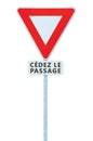 Give way yield french cÃÂ©dez le passage road sign, France, isolated vertical macro closeup, white signage triangle red frame