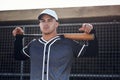 Give your best to every game. a young man holding his bat at a baseball game.