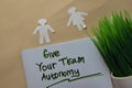 Give Your Team Autonomy write on a book isolated on office desk Royalty Free Stock Photo