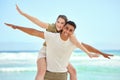 Give yourself the freedom you need. a young couple enjoying a day at the beach. Royalty Free Stock Photo