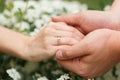He gives his girlfriend an engagement ring in the botanical garden Royalty Free Stock Photo