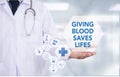 GIVING BLOOD SAVES LIFES Royalty Free Stock Photo