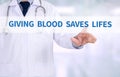 GIVING BLOOD SAVES LIFES Royalty Free Stock Photo