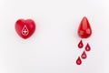 Giving blood saves live. Blood Donation concept. Red heart and blood drop on white background