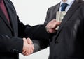 Giving a bribe into a pocket Royalty Free Stock Photo