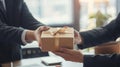 Giving a business gift, hand of two business professionals in a moment of gifting, Generative AI Royalty Free Stock Photo