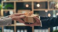 Giving a business gift, hand of two business professionals in a moment of gifting, Generative AI Royalty Free Stock Photo