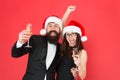 Giving Christmas toast. Happy family celebrate new year and Christmas. Couple in love with santa look party on Christmas