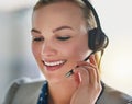 Giving every call her undivided attention. an attractive young woman wearing a headset in the office. Royalty Free Stock Photo