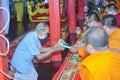 Taking things to the monks With respect Is a Buddhist tradition