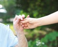 Giving a flower to senior lady