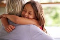 Giving granny a big hug. Shot of a cute little girl hugging her grandmother. Royalty Free Stock Photo