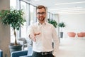 Giving hand to make handshake. Elegant man in formal clothes is indoors Royalty Free Stock Photo