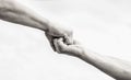 Giving a helping hand. Hands of man and woman on sky background. Lending a helping hand. Hands of man and woman reaching Royalty Free Stock Photo
