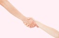 Giving a helping hand isolated on pink background, female hand