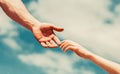 Giving a helping hand. Lending a helping hand. Hands of man and woman reaching to each other, support. Hands of man and Royalty Free Stock Photo