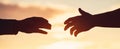 Giving a helping hand. Rescue, helping gesture or hands. Outstretched hands, salvation, help silhouette, concept of help Royalty Free Stock Photo