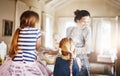 Giving her kids fun memories to cherish for life. two little girls having fun while baking with their mother in the Royalty Free Stock Photo