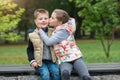 Giving her little brother a kiss outside Royalty Free Stock Photo