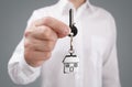 Giving house key on keychain Royalty Free Stock Photo