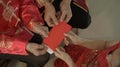 Giving red envelop for Chinese New Year Top view grandparent and five money to child Royalty Free Stock Photo