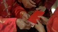 Giving red envelop for Chinese New Year Top view grandparent and five money to child Royalty Free Stock Photo