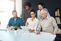 Giving their work one last look over. a group of coworkers talking together over a digital tablet in a boardroom. Royalty Free Stock Photo