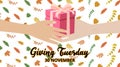 Giving Tuesday background design with a hand giving a gift to another hand Royalty Free Stock Photo