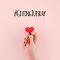 Giving Tuesday concept with red heart in hand Royalty Free Stock Photo