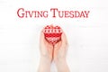 Giving Tuesday concept with red heart in hands Royalty Free Stock Photo