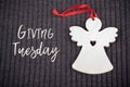 Giving Tuesday concept with Wooden Angel Royalty Free Stock Photo