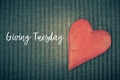 Giving Tuesday concept with wooden red heart Royalty Free Stock Photo