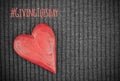 Giving Tuesday concept with wooden red heart