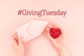 Giving Tuesday concept with red heart in hand Royalty Free Stock Photo