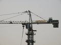 Cranes at a construction site of a new high rise in Egypt new buildings under construction and skyscrapers Royalty Free Stock Photo