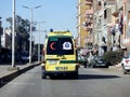 Ambulance on road responding for an emergency call of road accidents, Translation of Arabic text (