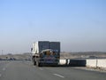 Giza, Egypt, January 26 2023: A big truck loaded with large blocks of stone, limestone, rocks taken from quarries in mountains