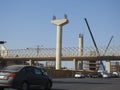 Giza Egyptian overhead transportation system monorail construction site with concrete and steel columns and cranes