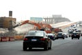 26th of July corridor road development project, removing an old bridge by demolition pliers jaws excavators