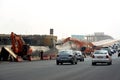 26th of July corridor road development project, removing an old bridge by demolition pliers jaws excavators