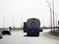 Giza, Egypt, March 9 2023: A big truck with a container tank with petroleum products, a lorry on the highway with a container on