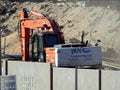 Excavator truck at a construction site of new buildings in Giza Zed city project, heavy machinery transport vehicle
