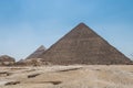 The Giza pyramid complex, an archaeological site on the Giza Plateau, on the outskirts of Cairo, Egypt. It includes the three Royalty Free Stock Photo