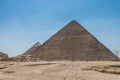 The Giza pyramid complex, an archaeological site on the Giza Plateau, on the outskirts of Cairo, Egypt. It includes the three Royalty Free Stock Photo