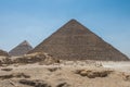 The Giza pyramid complex, an archaeological site on the Giza Plateau, on the outskirts of Cairo, Egypt. It includes the three Royalty Free Stock Photo