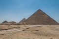 The Giza pyramid complex, an archaeological site on the Giza Plateau, on the outskirts of Cairo, Egypt. It includes the three Royalty Free Stock Photo
